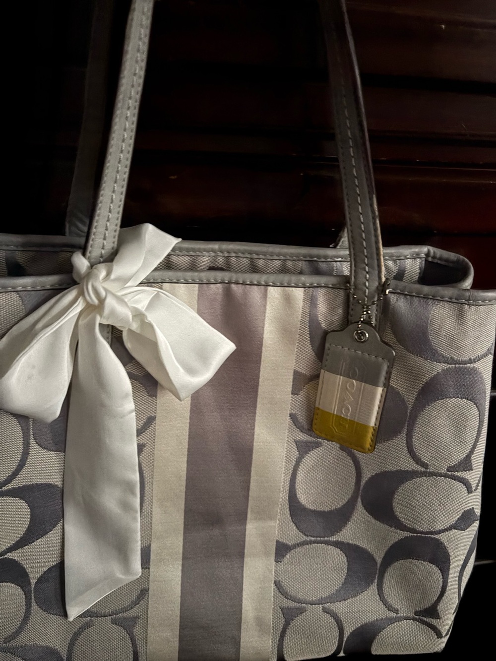 Beautiful Silver & Gray C Patterned Coach Tote with Ivory Bow Accent.